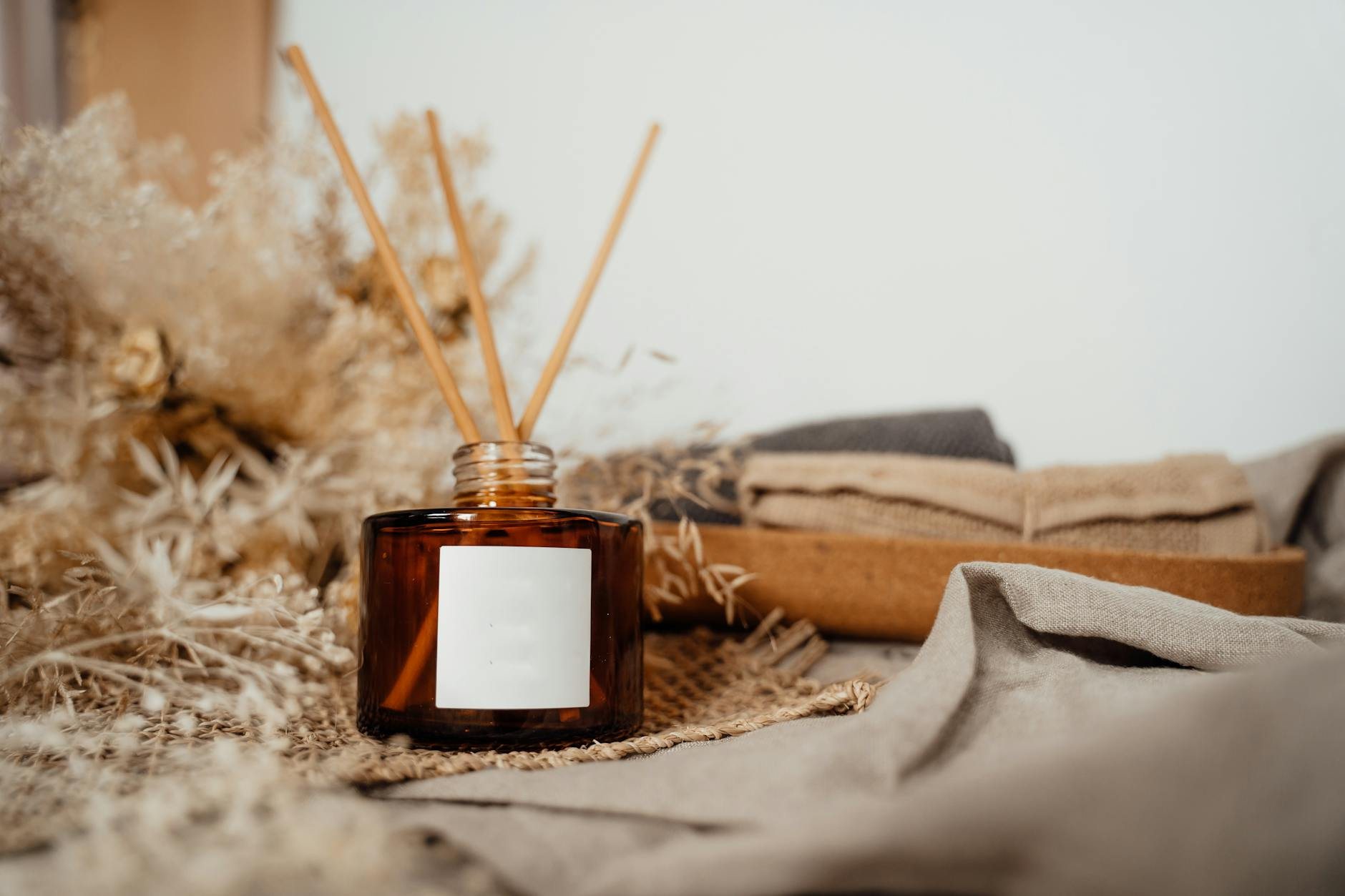Detailed view of fragrance bottle labels, caps, and packaging elements ready for product photography